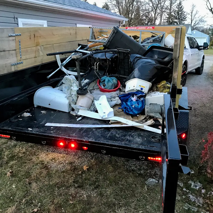 Roll-off dumpster delivered to a residential driveway in Tequesta